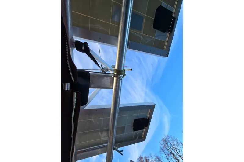 Slide: The Image of View of solar panels on a 1986 Hans Christian 38T sailboat under a clear blue sky. - 19