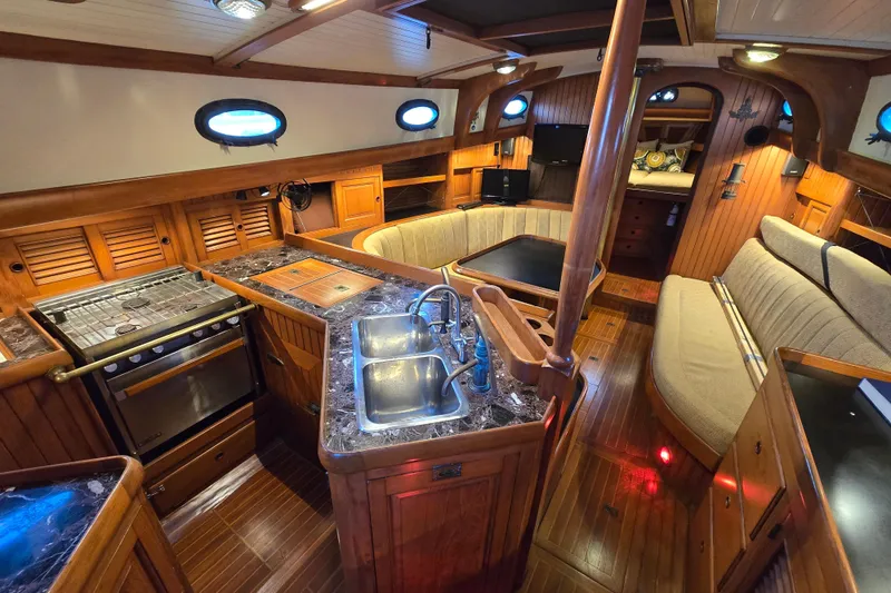 Slide: The Image of Luxurious 1986 Hans Christian 38T yacht interior with wood finishes and modern amenities. - 2