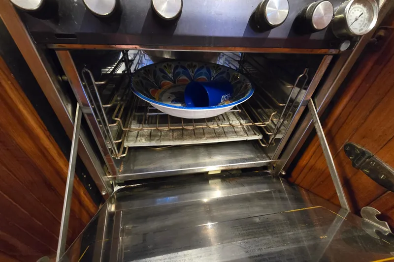 Slide: The Image of Open oven with colorful bowl inside, aboard 1986 Hans Christian 38T yacht. - 23