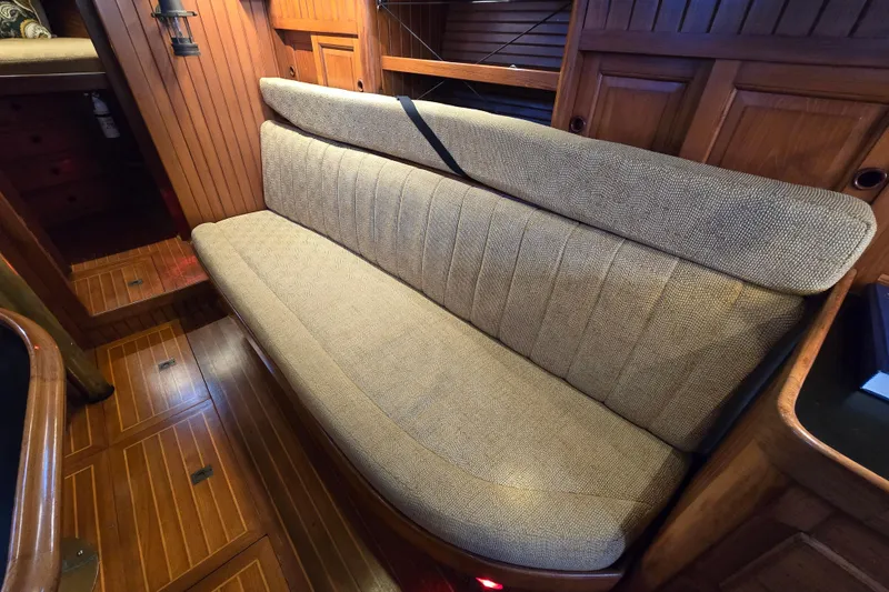 Slide: The Image of 1986 Hans Christian 38T interior with wooden paneling and cushioned seating. - 36