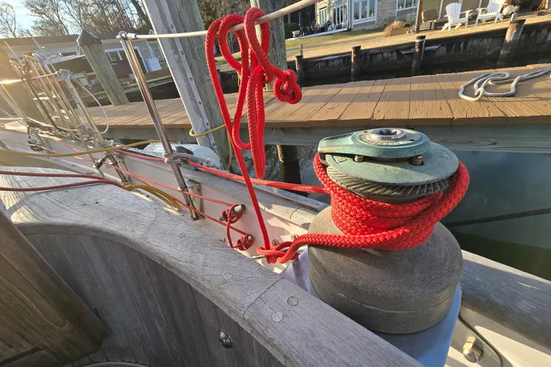 Slide: The Image of 1986 Hans Christian 38T sailboat deck with red rope and winch by the dock. - 51