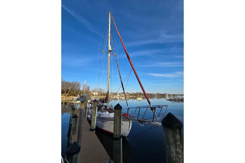 Slide: The Image of 1986 Hans Christian 38T sailboat docked on a calm, sunny day. - 56