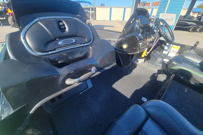 Slide: The Image of Interior of a 2018 Nitro Z18 boat, featuring steering console and seating. - 14