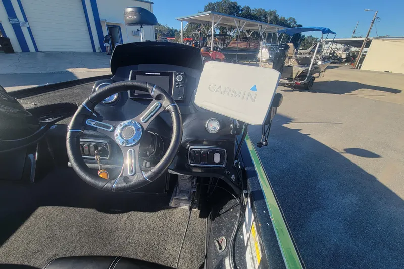 Slide: The Image of Nitro Z18 2018 boat dashboard with Garmin navigation system and steering wheel. - 15