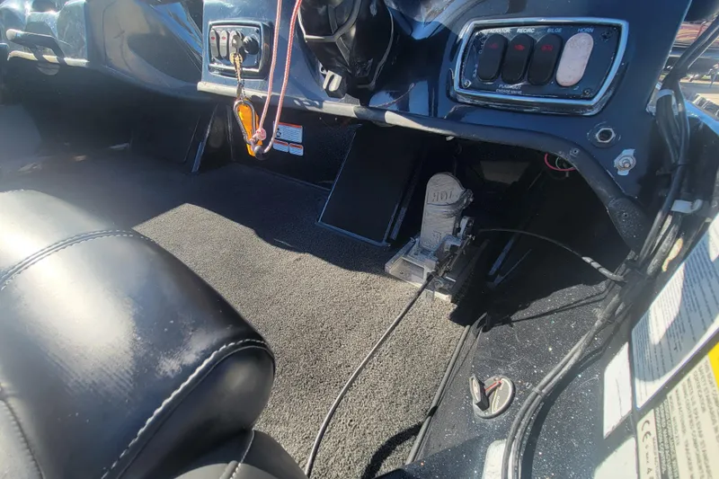 Slide: The Image of Interior of a 2018 Nitro Z18 boat showing dashboard controls and seating. - 17