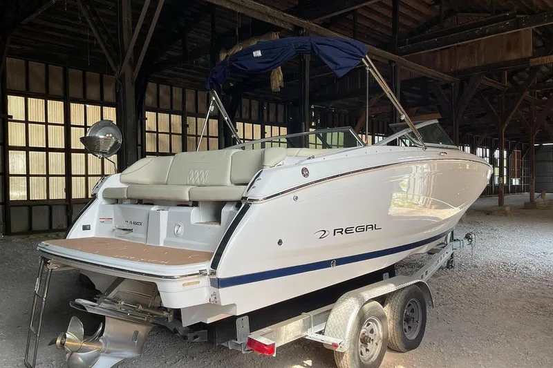 Slide: The Image of 2019 Regal 22 FasDeck boat on trailer, side view, with registration number NJ 4646 HM. - 1