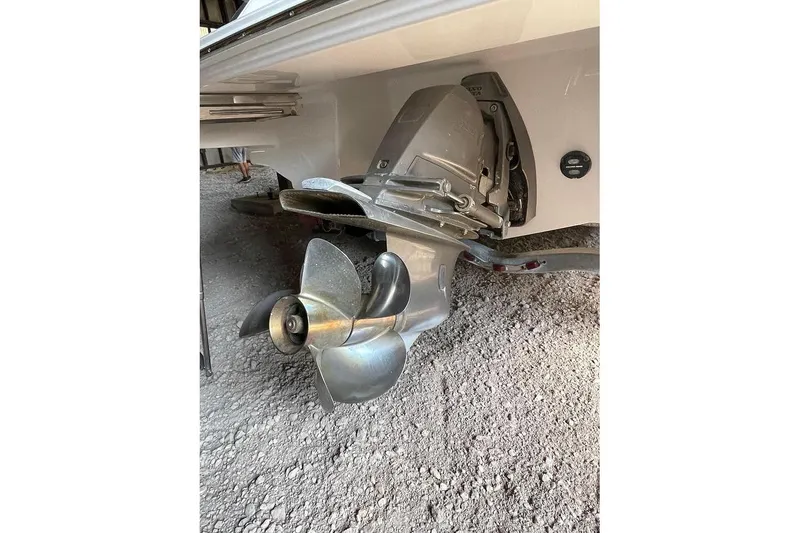 Slide: The Image of 2019 Regal 22 FasDeck boat interior with beige seating and steering console. - 10