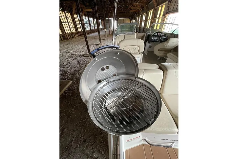 Slide: The Image of 2019 Regal 22 FasDeck boat detail showing a fuel cap on a trailer. - 13