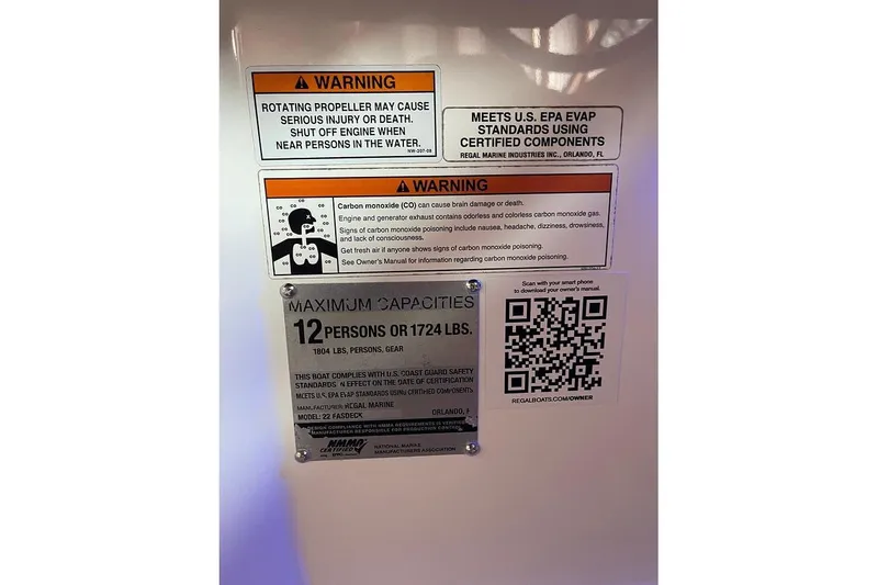 Slide: The Image of 2019 Regal 22 FasDeck boat with onboard grill in a rustic boathouse setting. - 15