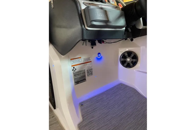 Slide: The Image of 2019 Regal 22 FasDeck boat interior with beige seating and cup holder. - 19