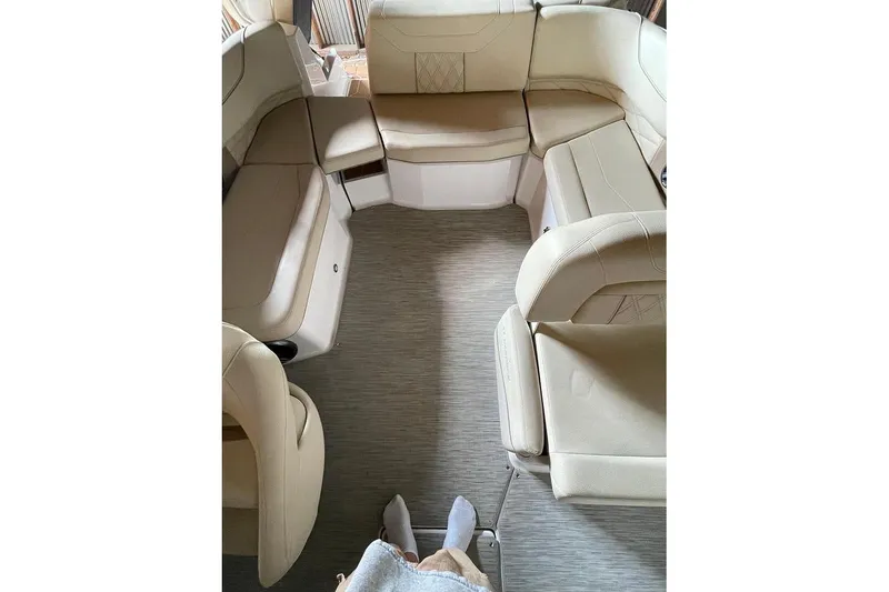 Slide: The Image of 2019 Regal 22 FasDeck boat interior with storage compartment and speaker. - 27