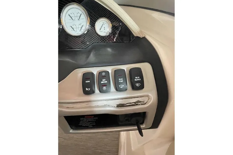 Slide: The Image of Interior of 2019 Regal 22 FasDeck boat with beige seating and spacious layout. - 29