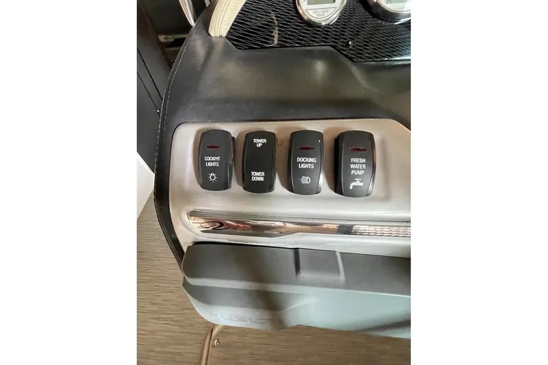 Slide: The Image of 2019 Regal 22 FasDeck dashboard with switches and gauges. - 31