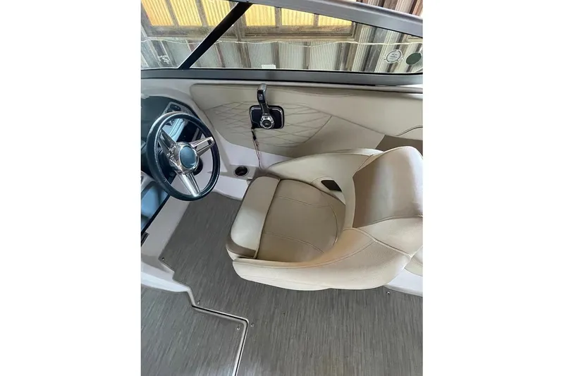 Slide: The Image of 2019 Regal 22 FasDeck boat interior with compact portable toilet. - 32