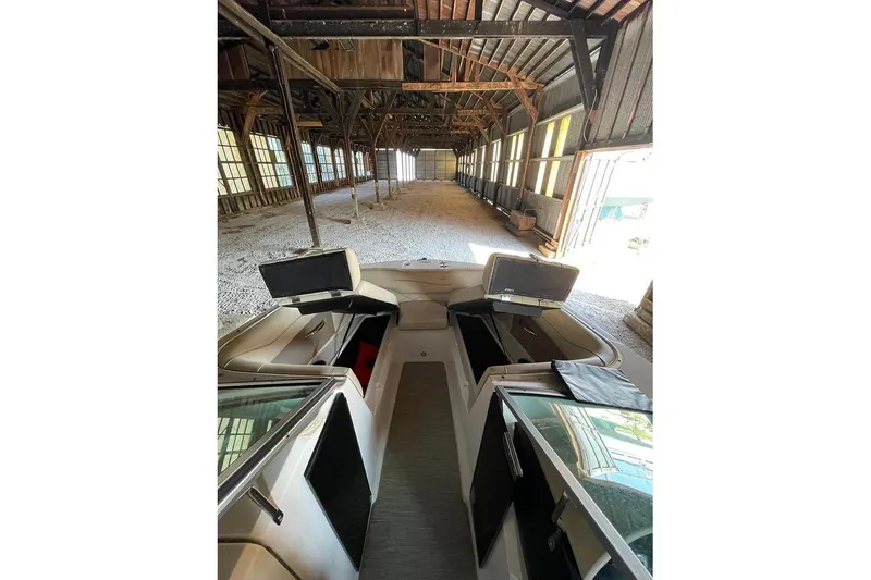 Slide: The Image of 2019 Regal 22 FasDeck boat interior in rustic wooden barn setting. - 35
