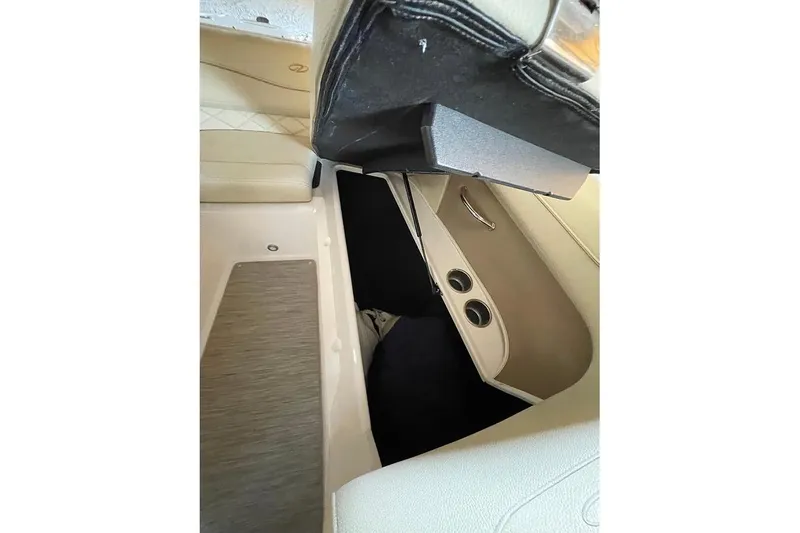 Slide: The Image of Interior of a 2019 Regal 22 FasDeck boat with steering wheel and seating. - 36