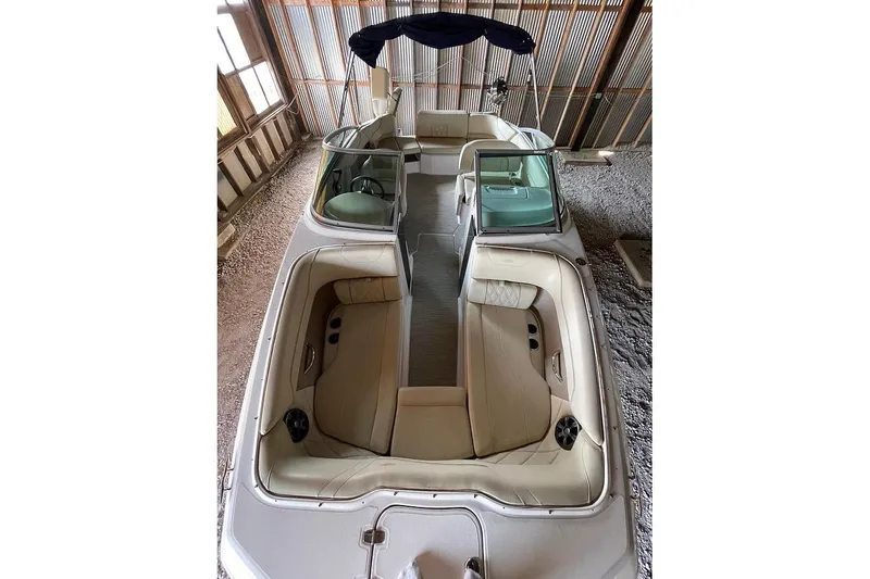 Slide: The Image of 2019 Regal 22 FasDeck boat interior with beige seating and speaker detail. - 40