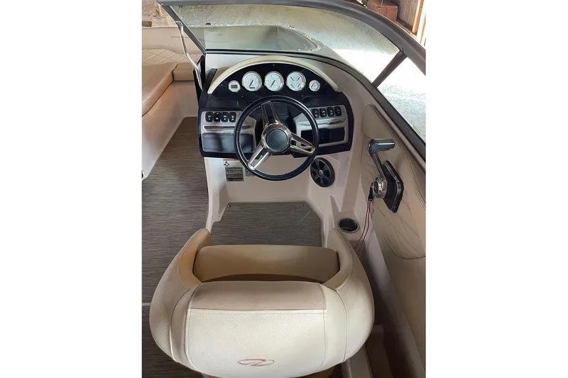 Slide: The Image of 2019 Regal 22 FasDeck boat interior with beige seating and speaker. - 41