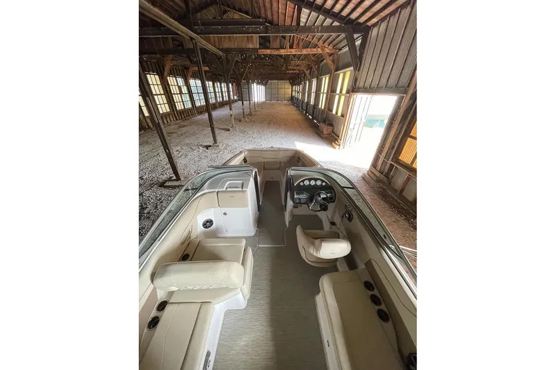 Slide: The Image of 2019 Regal 22 FasDeck boat cockpit with steering wheel and control panel. - 43