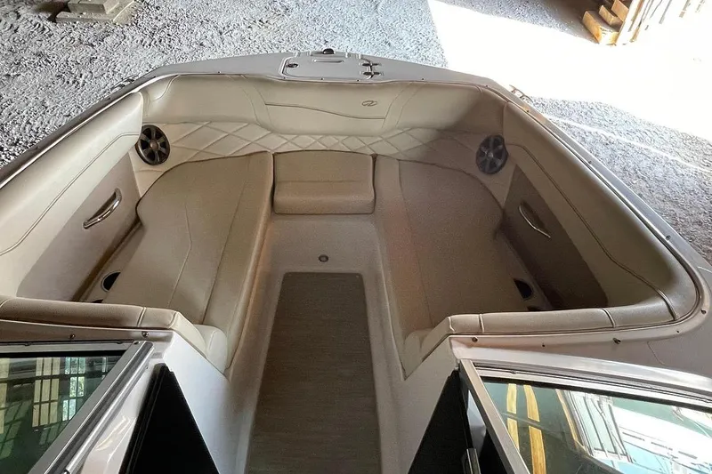 Slide: The Image of 2019 Regal 22 FasDeck boat interior in a rustic warehouse setting. - 45