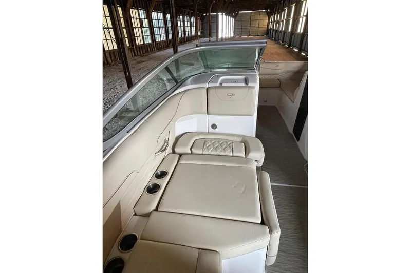 Slide: The Image of 2019 Regal 22 FasDeck boat interior in a spacious storage facility. - 46