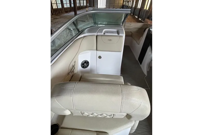 Slide: The Image of 2019 Regal 22 FasDeck boat interior with beige seating and speakers. - 47