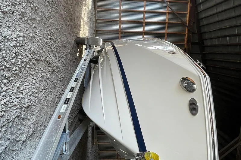 Slide: The Image of 2019 Regal 22 FasDeck boat interior with beige seating and cup holders. - 48