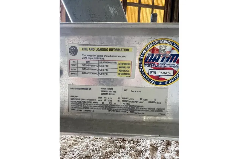 Slide: The Image of 2019 Regal 22 FasDeck boat on trailer in a warehouse setting. - 6