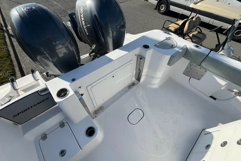 Slide: The Image of 2019 Sportsman Open 282 Center Console boat interior with seating and rod holders. - 10
