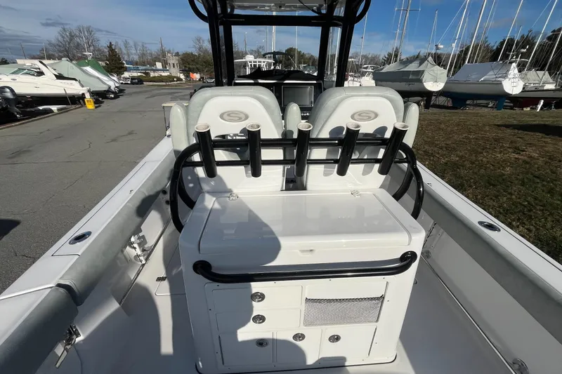 Slide: The Image of 2019 Sportsman Open 282 Center Console interior with storage drawers and seating. - 11