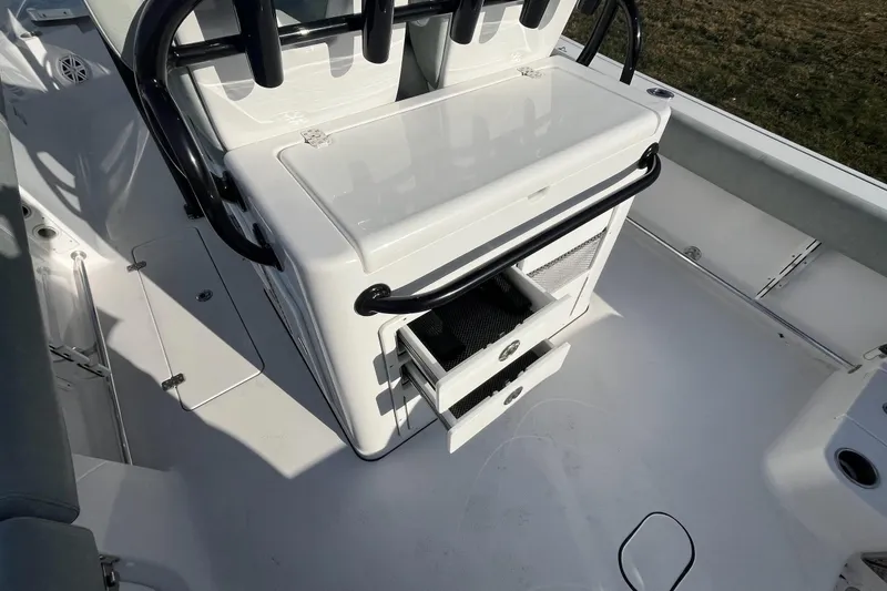 Slide: The Image of 2019 Sportsman Open 282 Center Console boat interior with steering wheel and control panel. - 12