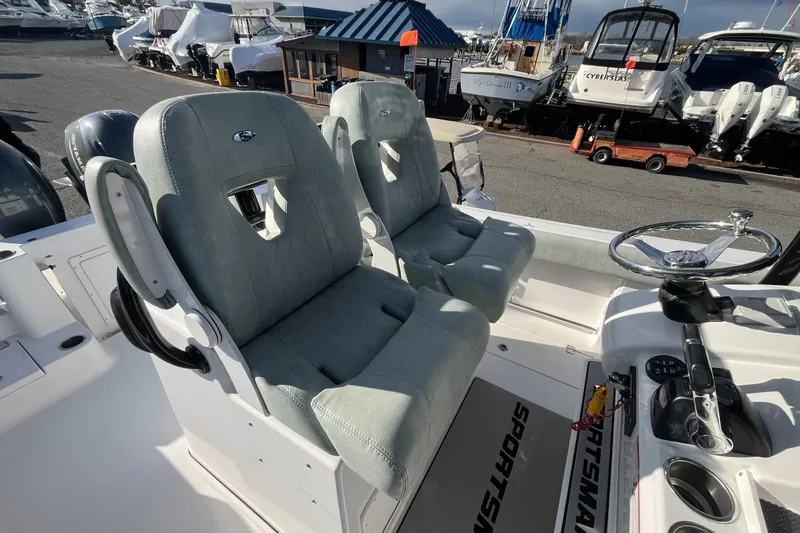 Slide: The Image of 2019 Sportsman Open 282 Center Console boat interior view at marina. - 14