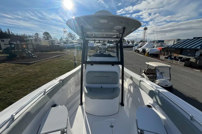 Slide: The Image of 2019 Sportsman Open 282 Center Console boat on display at a marina. - 16