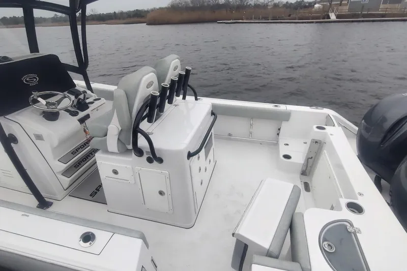 Slide: The Image of 2019 Sportsman Open 282 Center Console boat interior with seating and rod holders. - 3