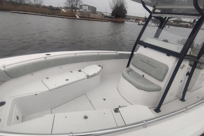 Slide: The Image of 2019 Sportsman Open 282 Center Console boat on calm water, featuring spacious seating. - 4