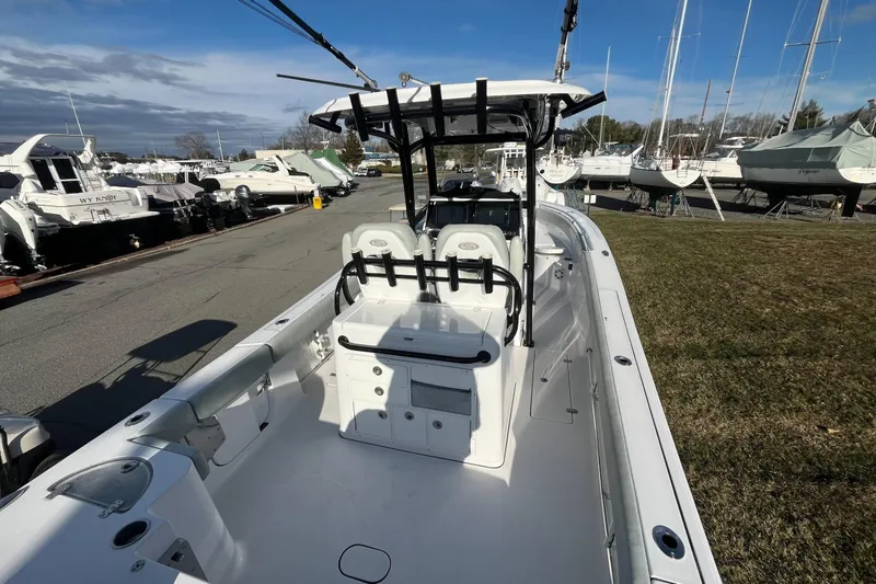 Slide: The Image of 2019 Sportsman Open 282 Center Console boat with dual Yamaha engines. - 9