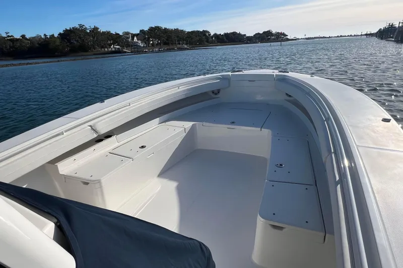 Slide: The Image of 2024 Regulator 34 Center Console boat cruising on a sunny day. - 7