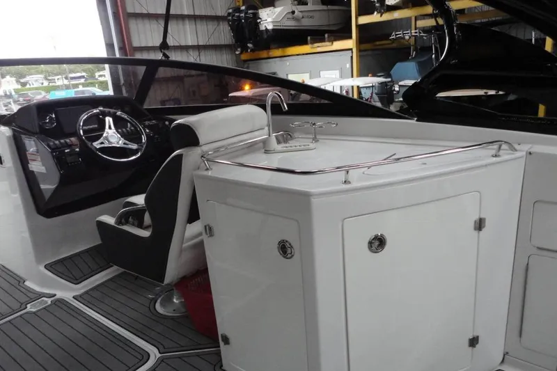 Slide: The Image of 2021 Monterey M-65 boat interior with sleek design and safety warning label. - 14