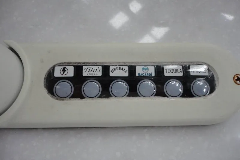 Slide: The Image of 2021 Monterey M-65 boat audio system with control panel and secure compartment. - 15