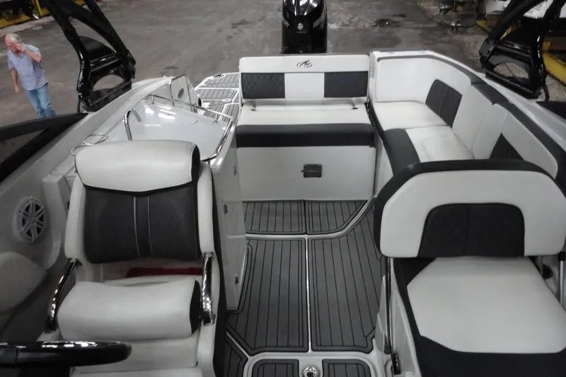 Slide: The Image of Luxurious seating in 2021 Monterey M-65 boat, featuring black and white upholstery. - 16