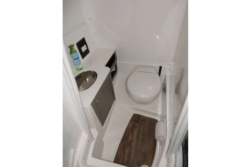 Slide: The Image of 2021 Monterey M-65 boat interior with steering wheel and control panel. - 17