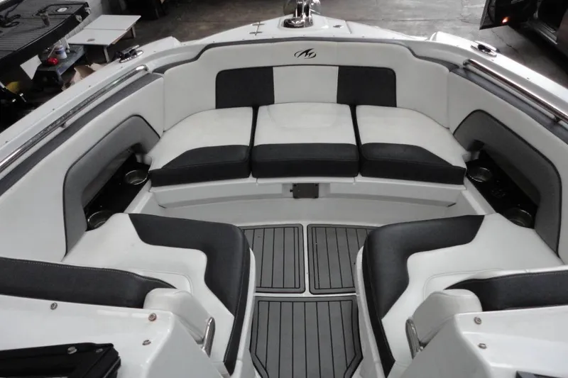 Slide: The Image of Interior of 2021 Monterey M-65 boat with helm, seating, and kitchenette. - 18