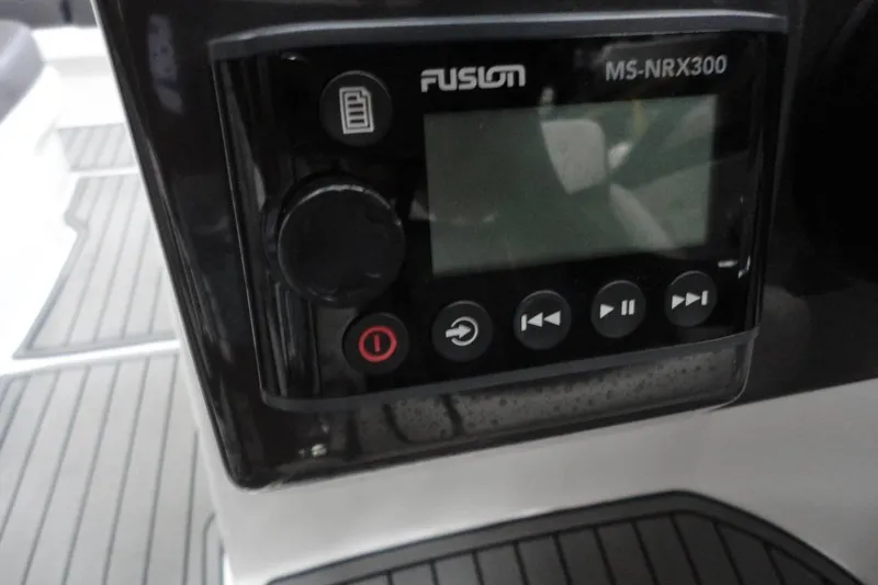 Slide: The Image of Captain's seat and helm of 2021 Monterey M-65 boat, featuring modern controls and design. - 22