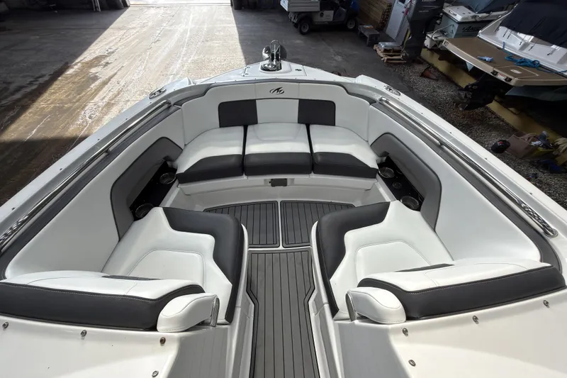 Slide: The Image of Luxurious seating area on a 2021 Monterey M-65 boat, featuring sleek white and black upholstery. - 29