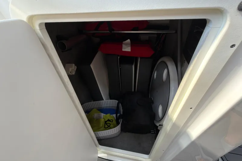 Slide: The Image of Storage compartment of a 2021 Monterey M-65 boat with life jackets and equipment. - 35