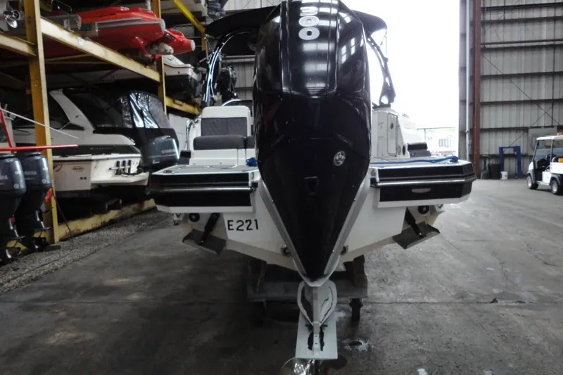 Slide: The Image of 2021 Monterey M-65 boat stored indoors, surrounded by other boats. - 6