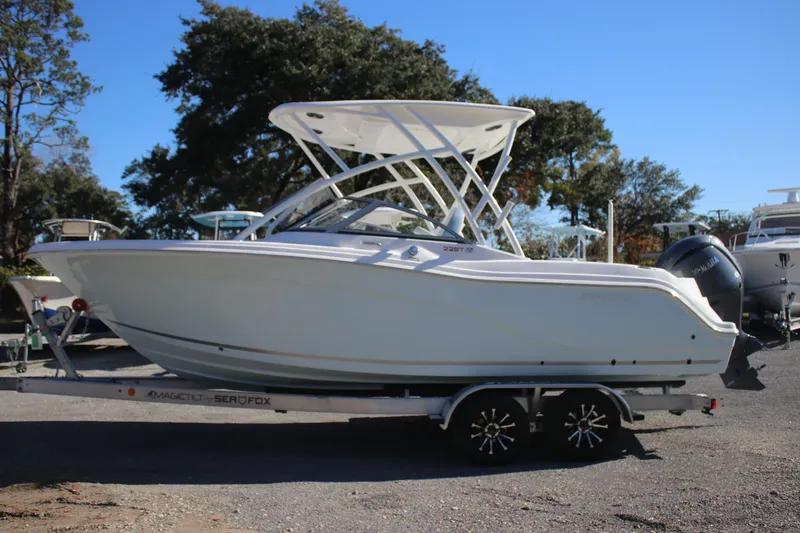 The Image of 2026 Sea Fox 228 Traveler boat on trailer, parked outdoors. - 0