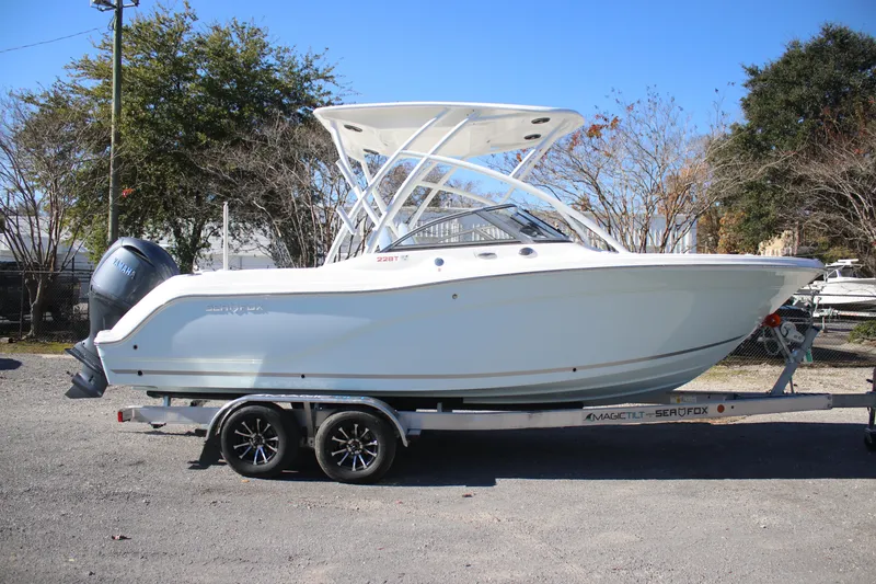 Slide: The Image of 2026 Sea Fox 228 Traveler boat on trailer, parked outdoors. - 2