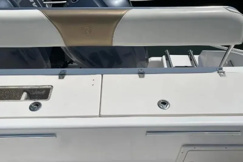 Slide: The Image of 2004 Century 3200 Center Console boat interior with seating and storage compartments. - 15