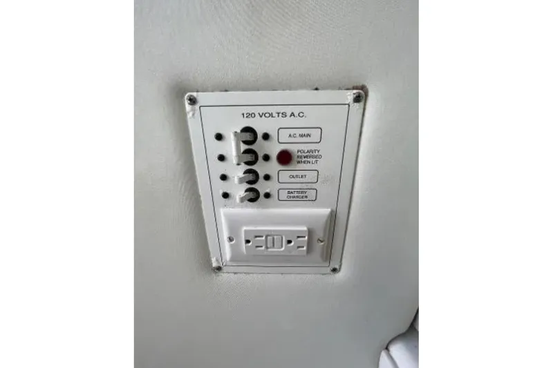 Slide: The Image of Electrical panel on 2004 Century 3200 Center Console boat, featuring 120 volts A.C. controls. - 25